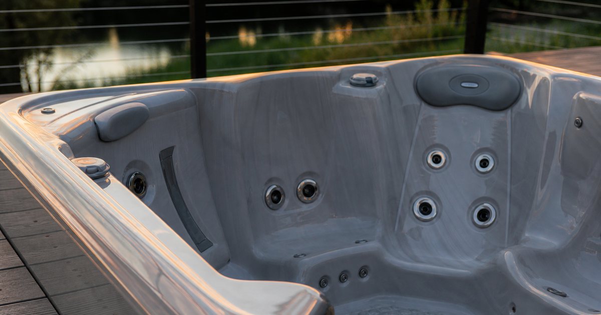 Which shell material lasts longest in a premium outdoor hot tub?